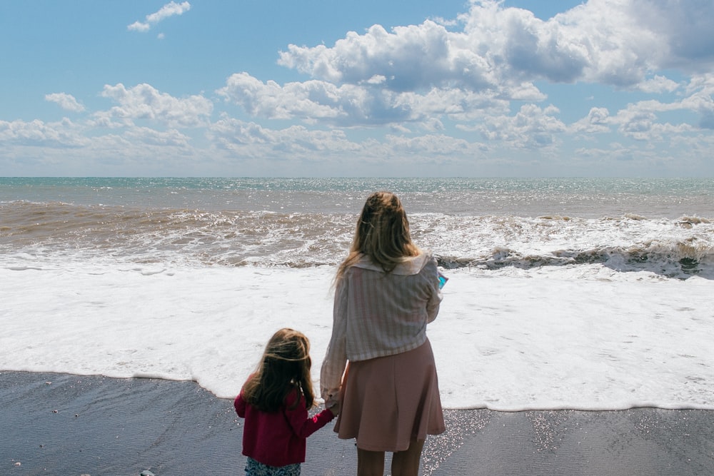 a group of women looking at waves