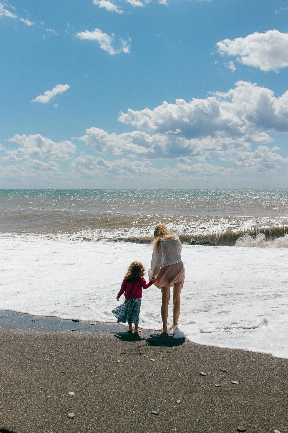 a person and a child on a beach