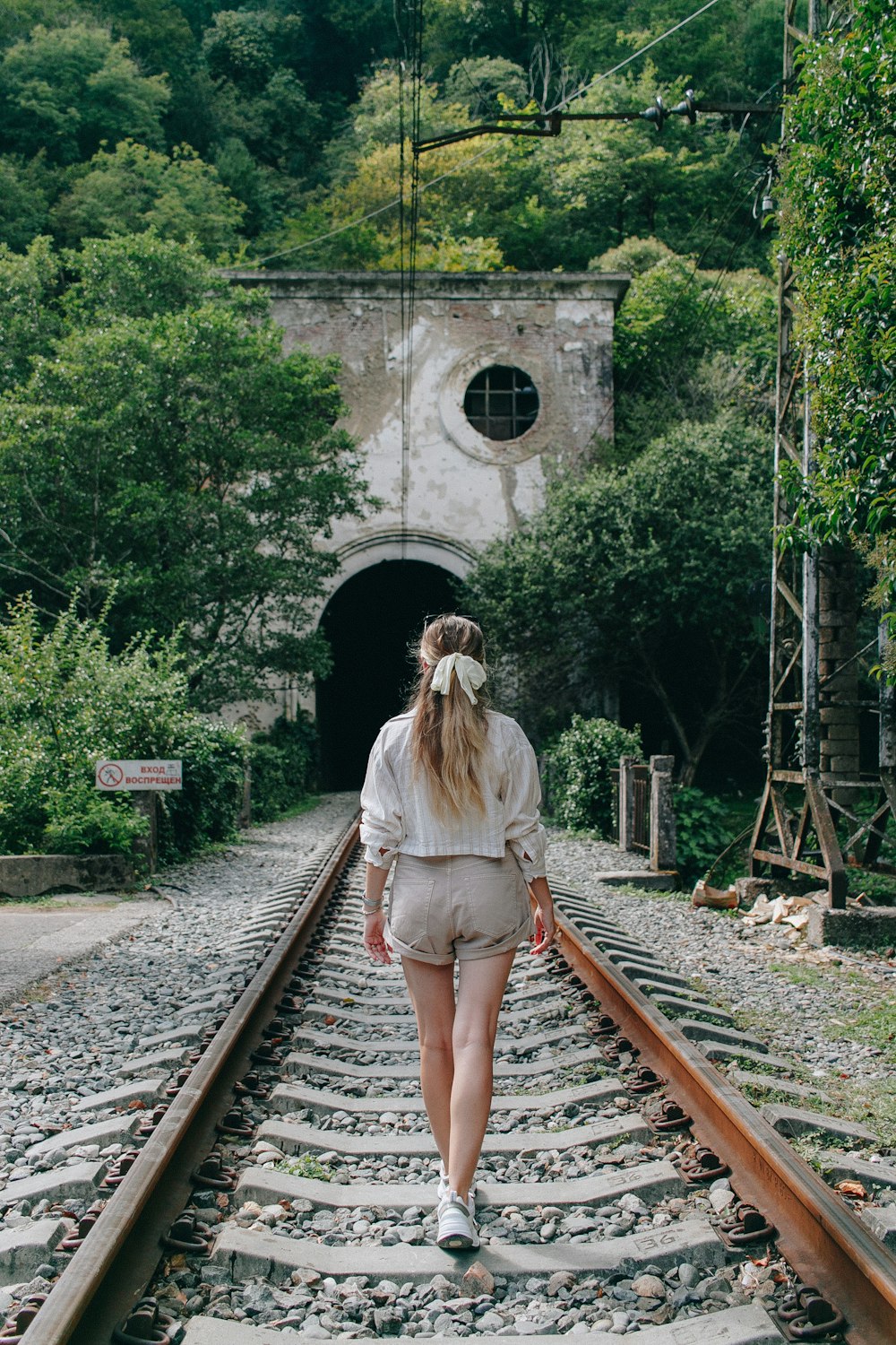 a person walking on train tracks
