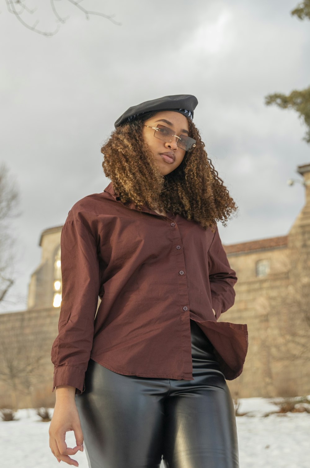 a person wearing a hat and glasses