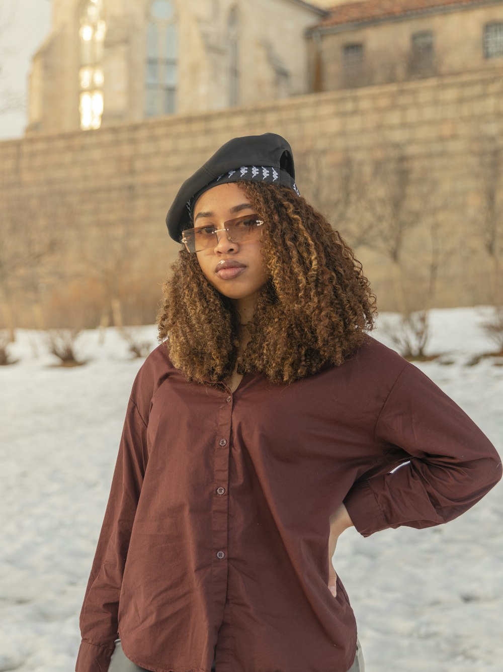 a person wearing a hat and glasses