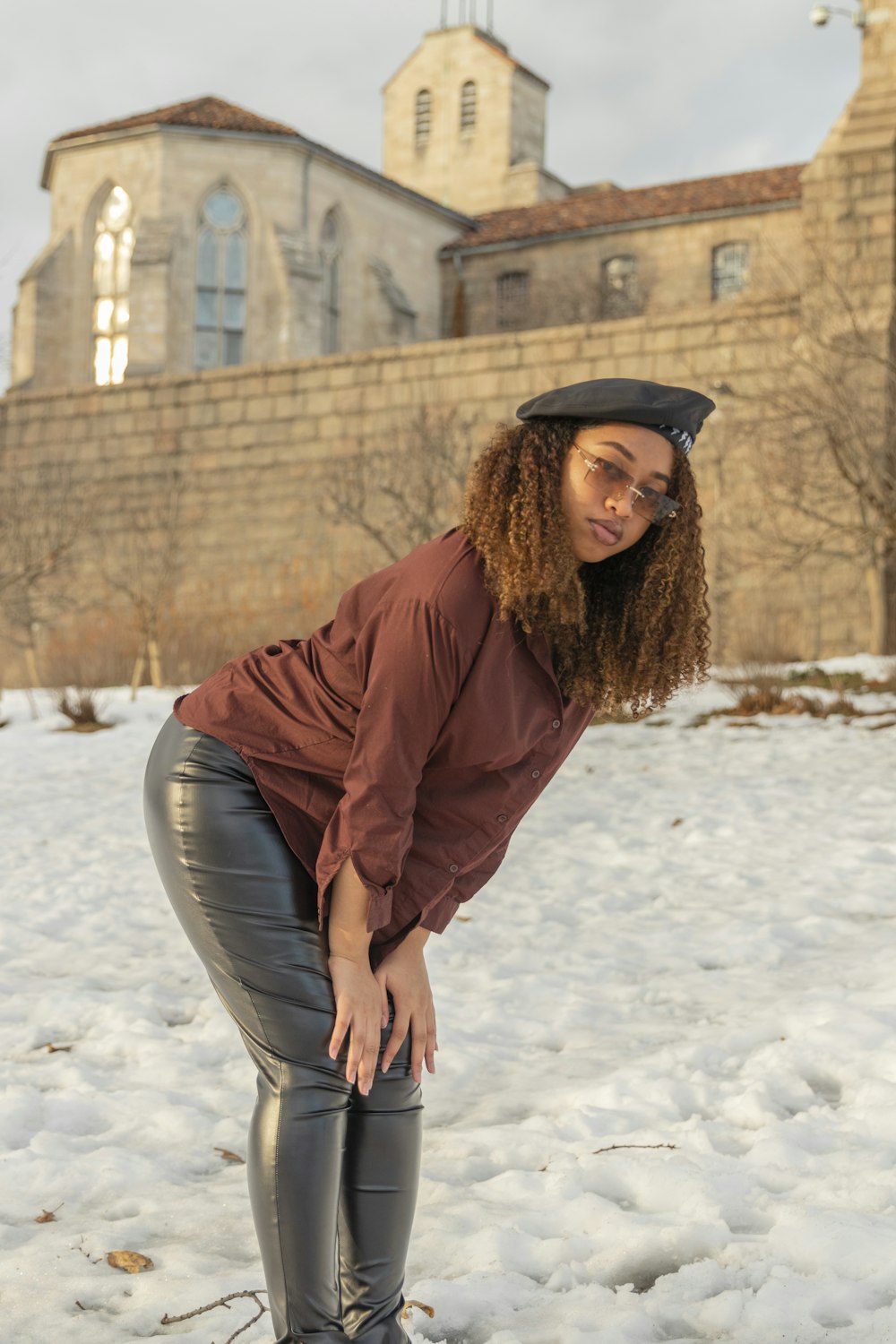 a woman standing in the snow