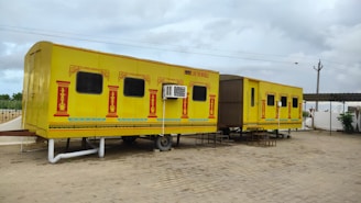 a couple of yellow and black trailers
