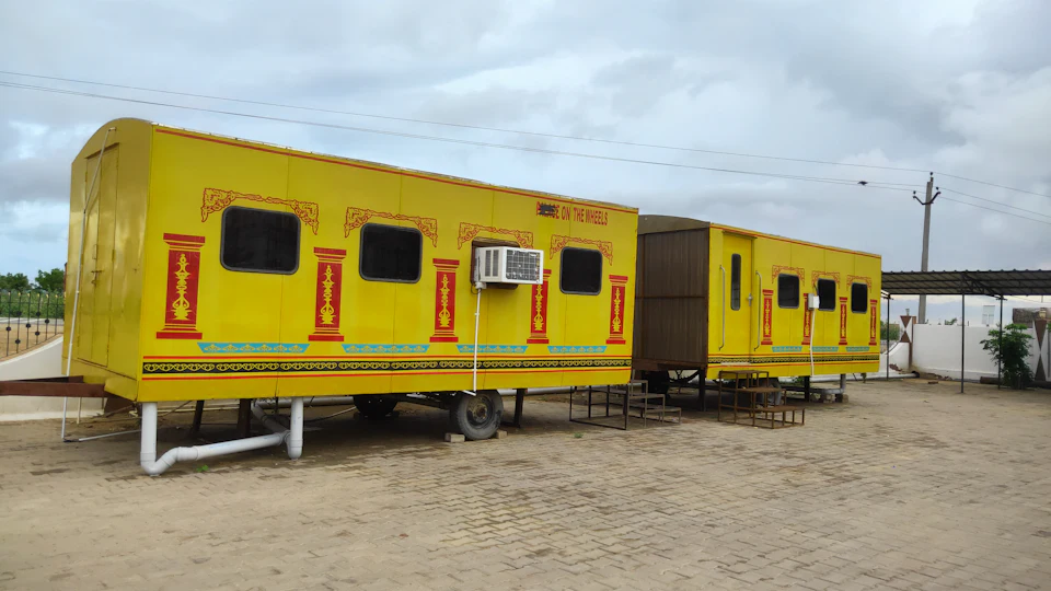 Yellow portable site cabins with windows and air conditioning units