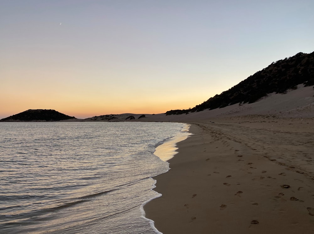 a beach with sand and water