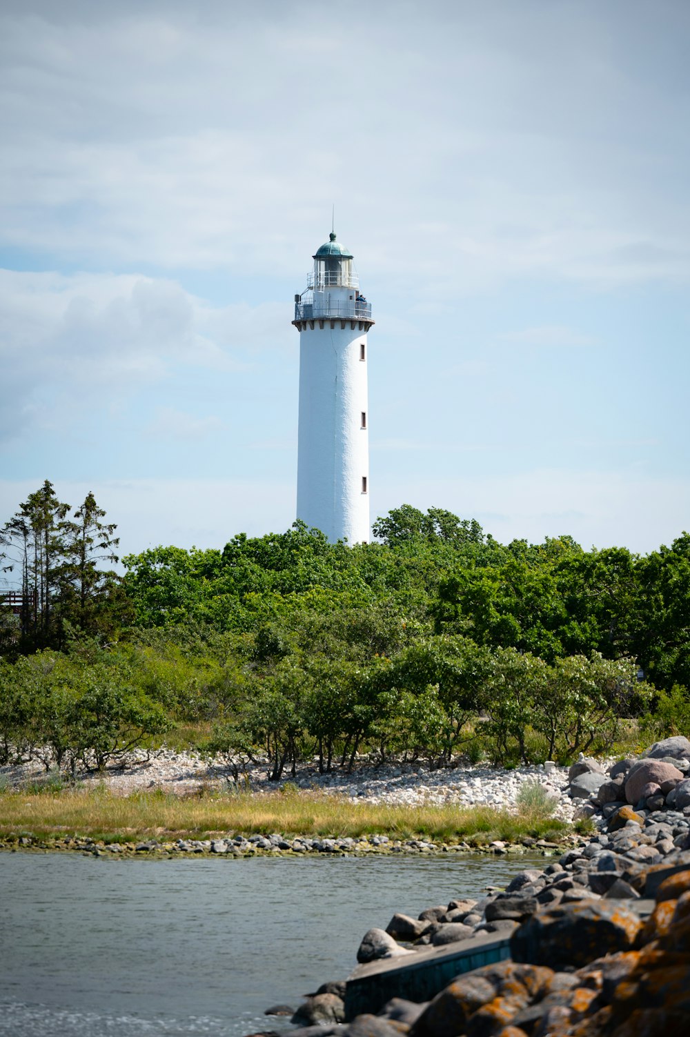 a lighthouse by a river