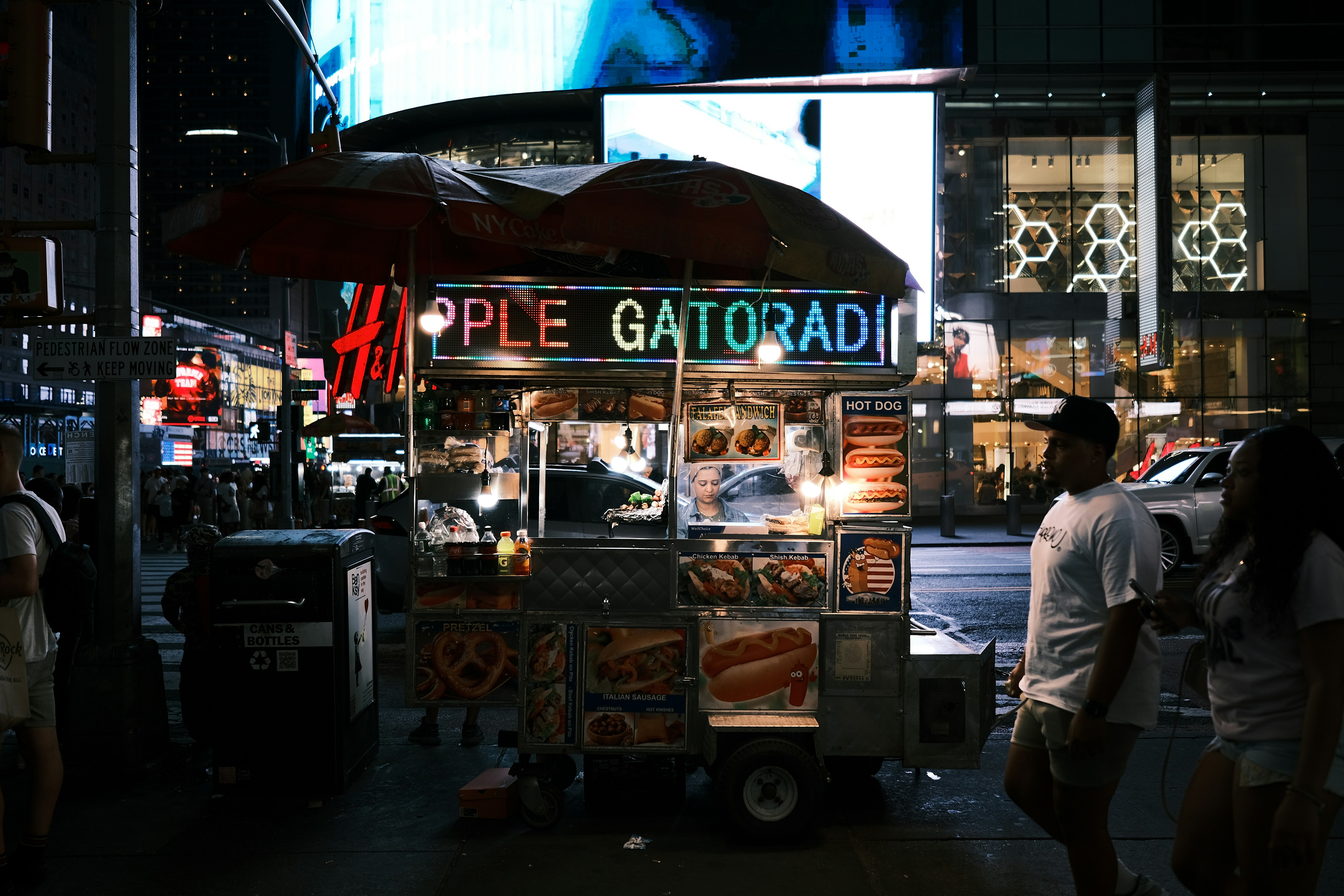 a food stand with a person standing next to it