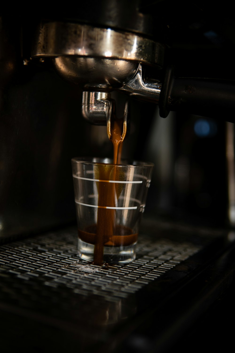 a glass of liquid being poured into a glass