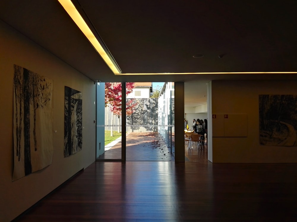 a hallway with a wood floor and a wood floor with a wood floor