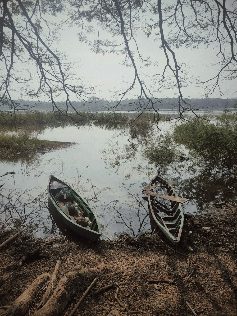 a couple of boats on a lake