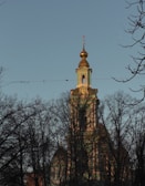 The front view of St. Thomas Syriac Orthodox Church bathed in soft morning light.
