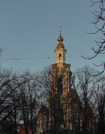 The front view of St. Thomas Syriac Orthodox Church bathed in soft morning light.