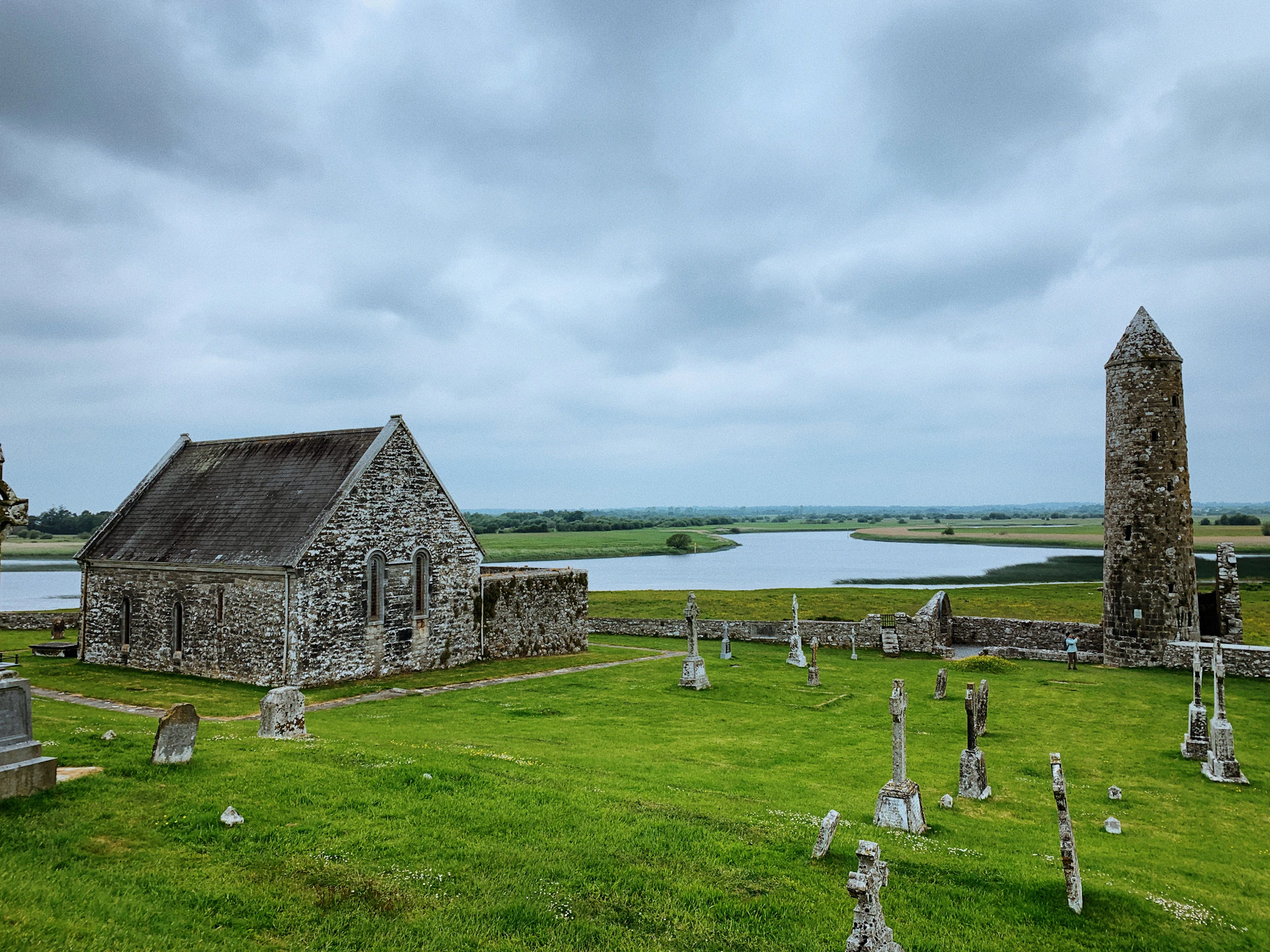 a cemetery with a stone building