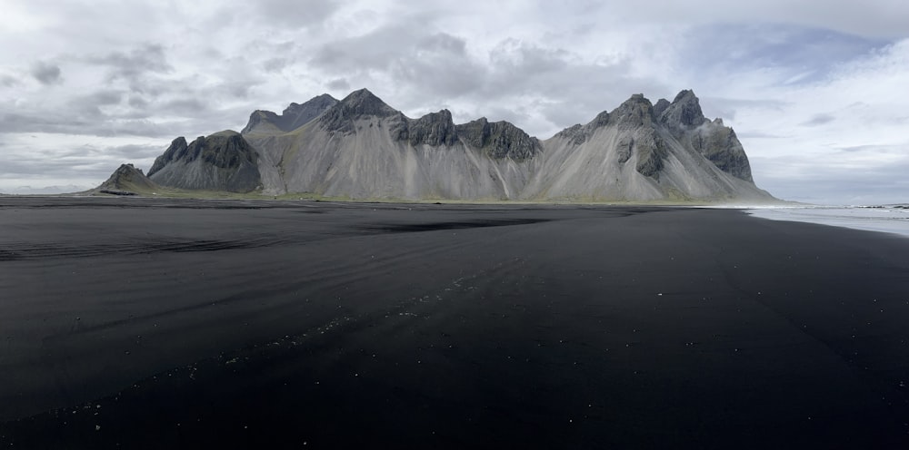 a large flat area with mountains in the background