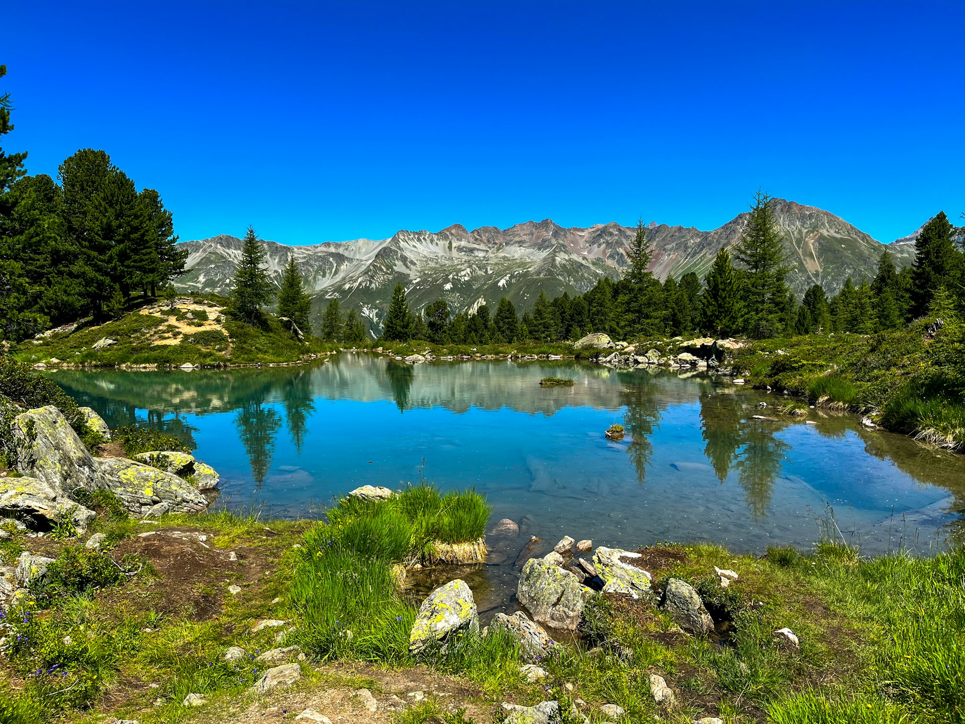 a lake surrounded by mountains