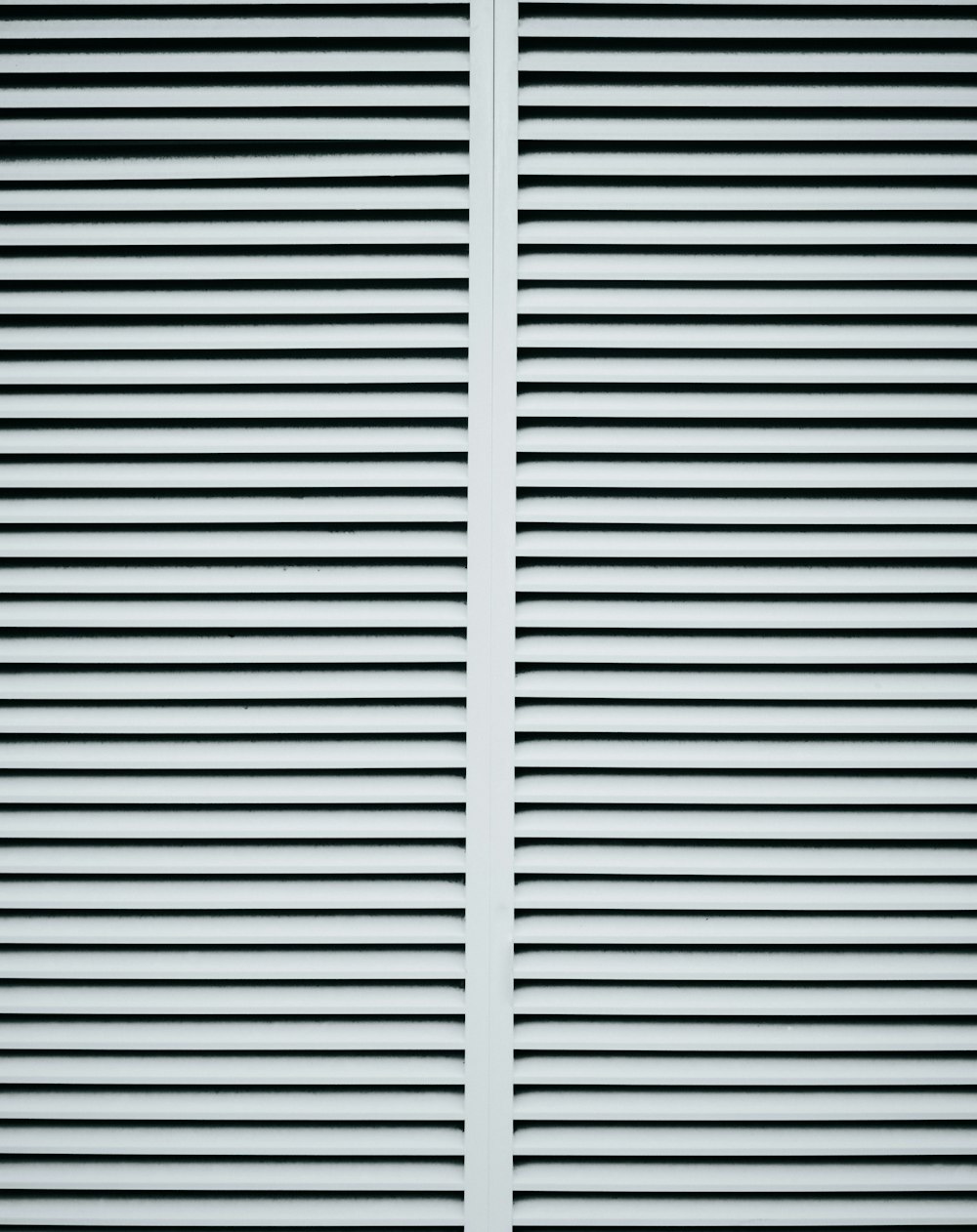 a white wall with black and white stripes