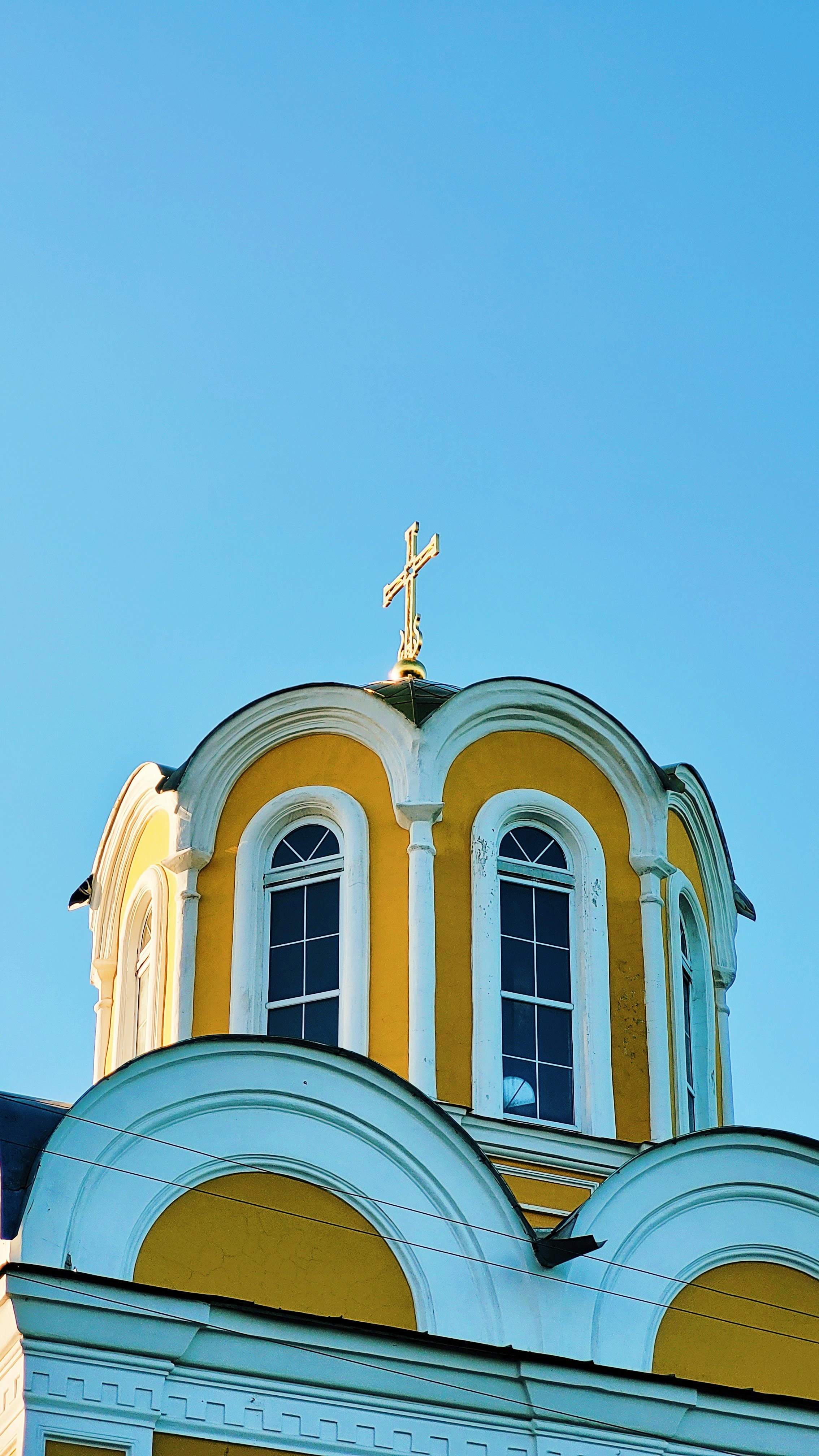 a building with a statue on top