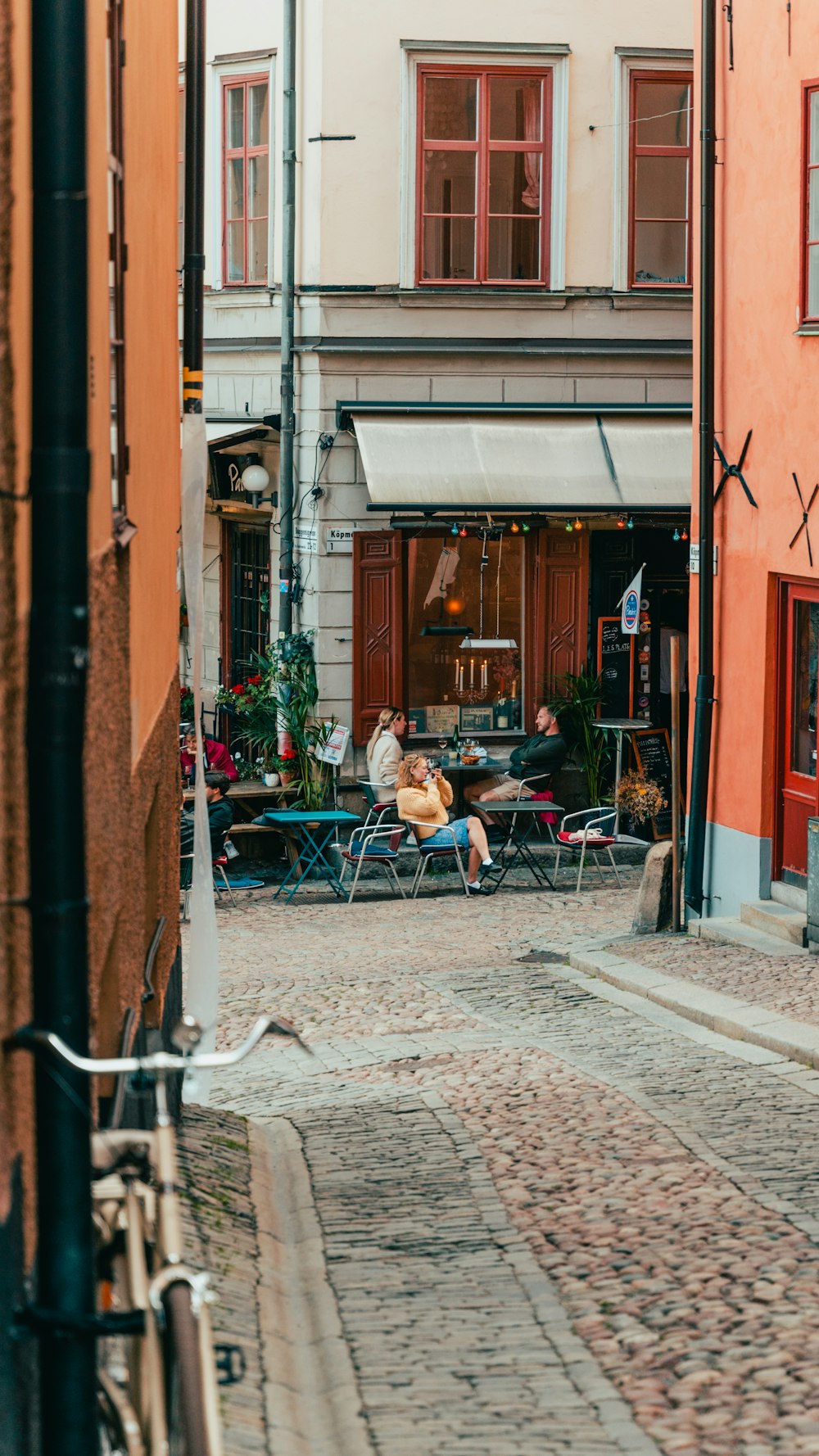 a group of people sitting outside a building