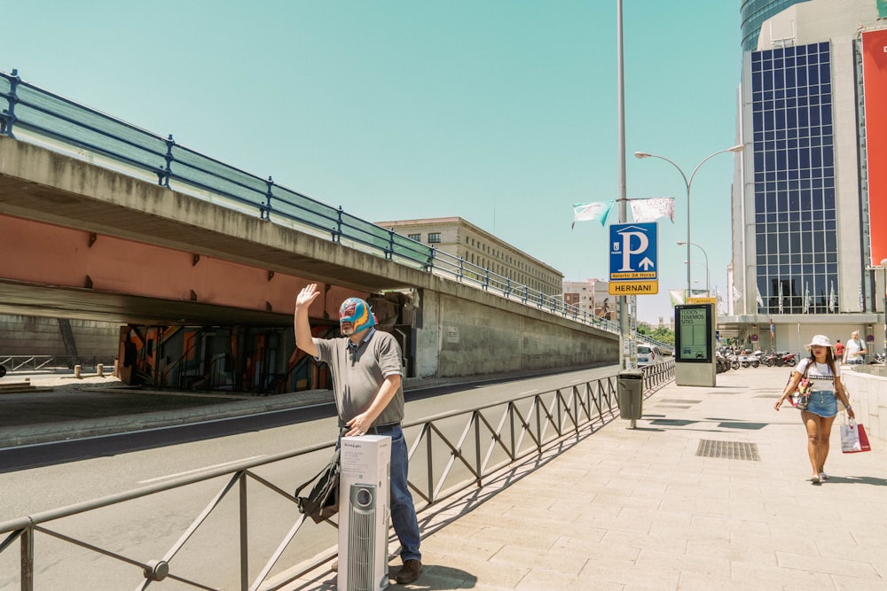 a person standing on a sidewalk