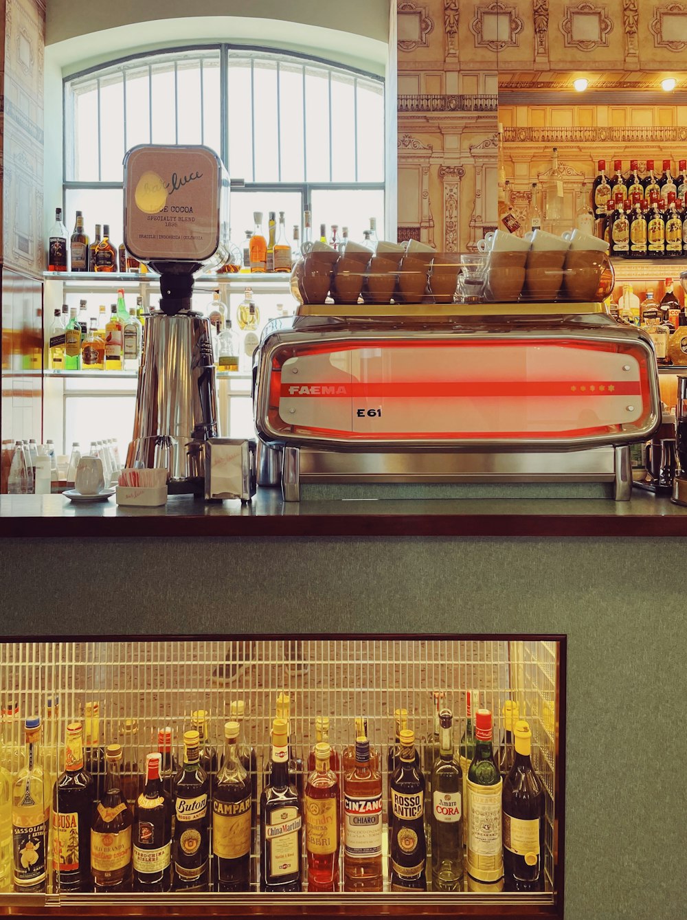 a bar with a large display of liquor bottles