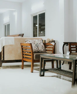 a room with a table chairs and a couch