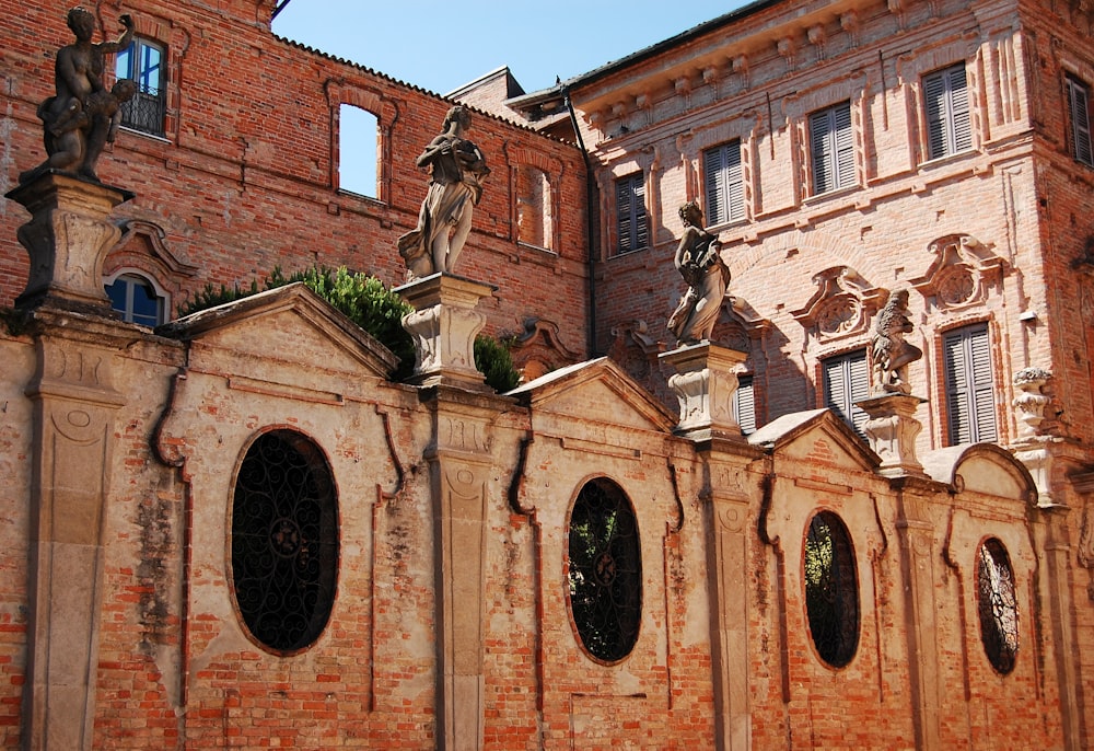 a building with statues on the outside