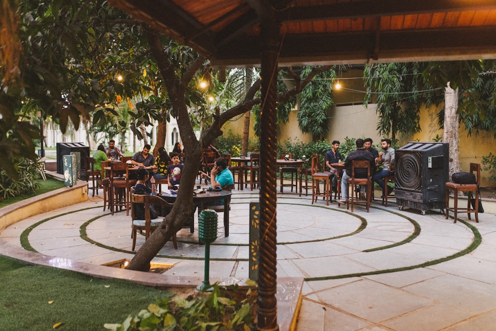 a group of people sitting at tables