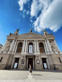 A recent photo of the school building with a banner celebrating the school's milestones.