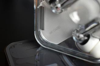 Close-up of a sleek modern gadget with minimalist design on a neutral background