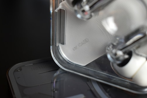 Close-up of a sleek futuristic product prototype with glowing interface elements.