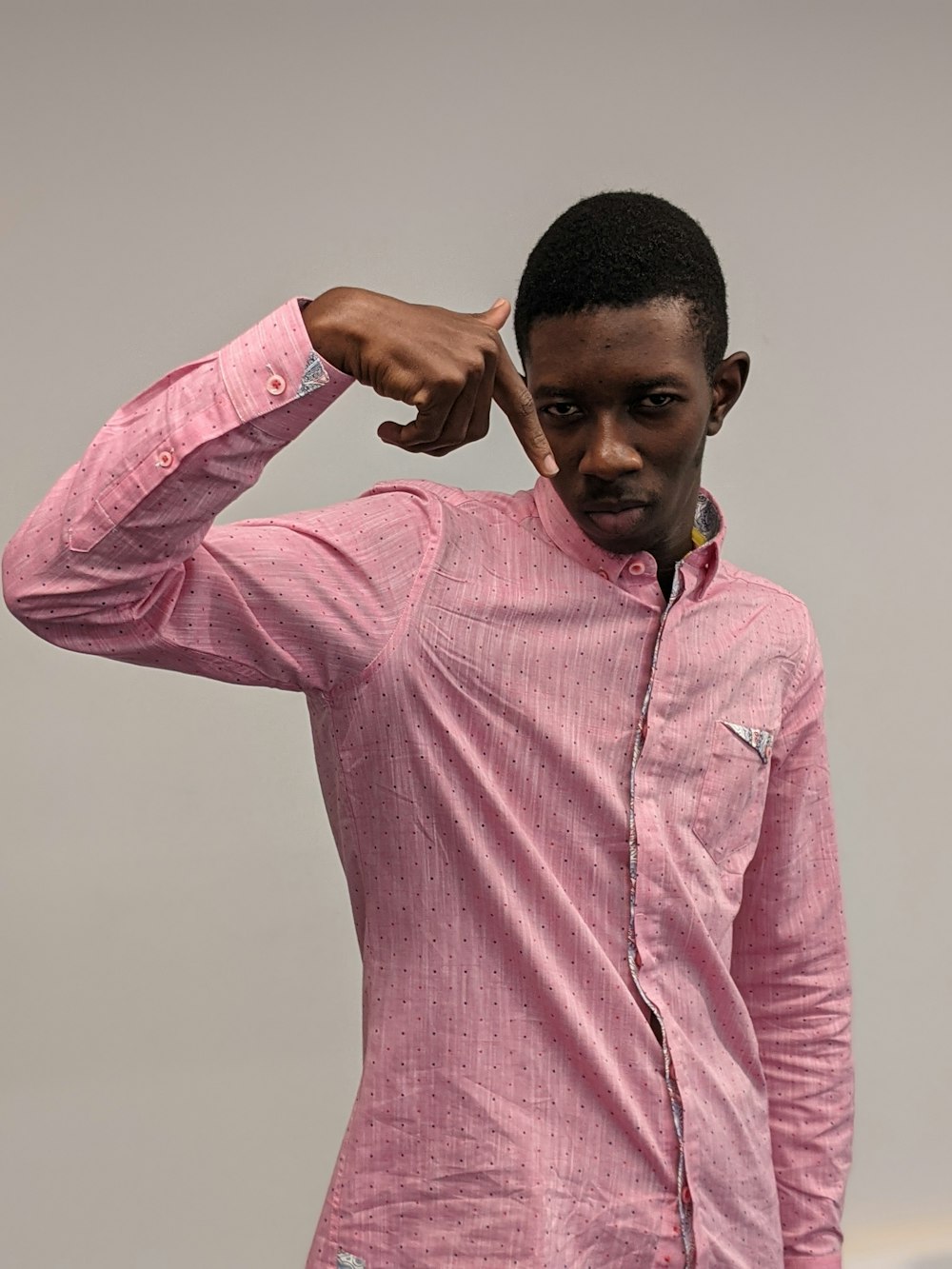 a man in a pink shirt