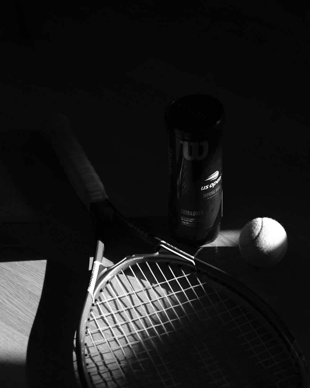 a tennis racket and a ball