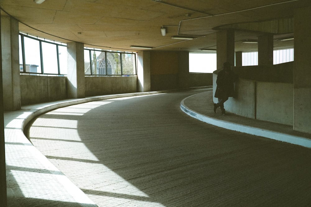 a person walking in a large empty room