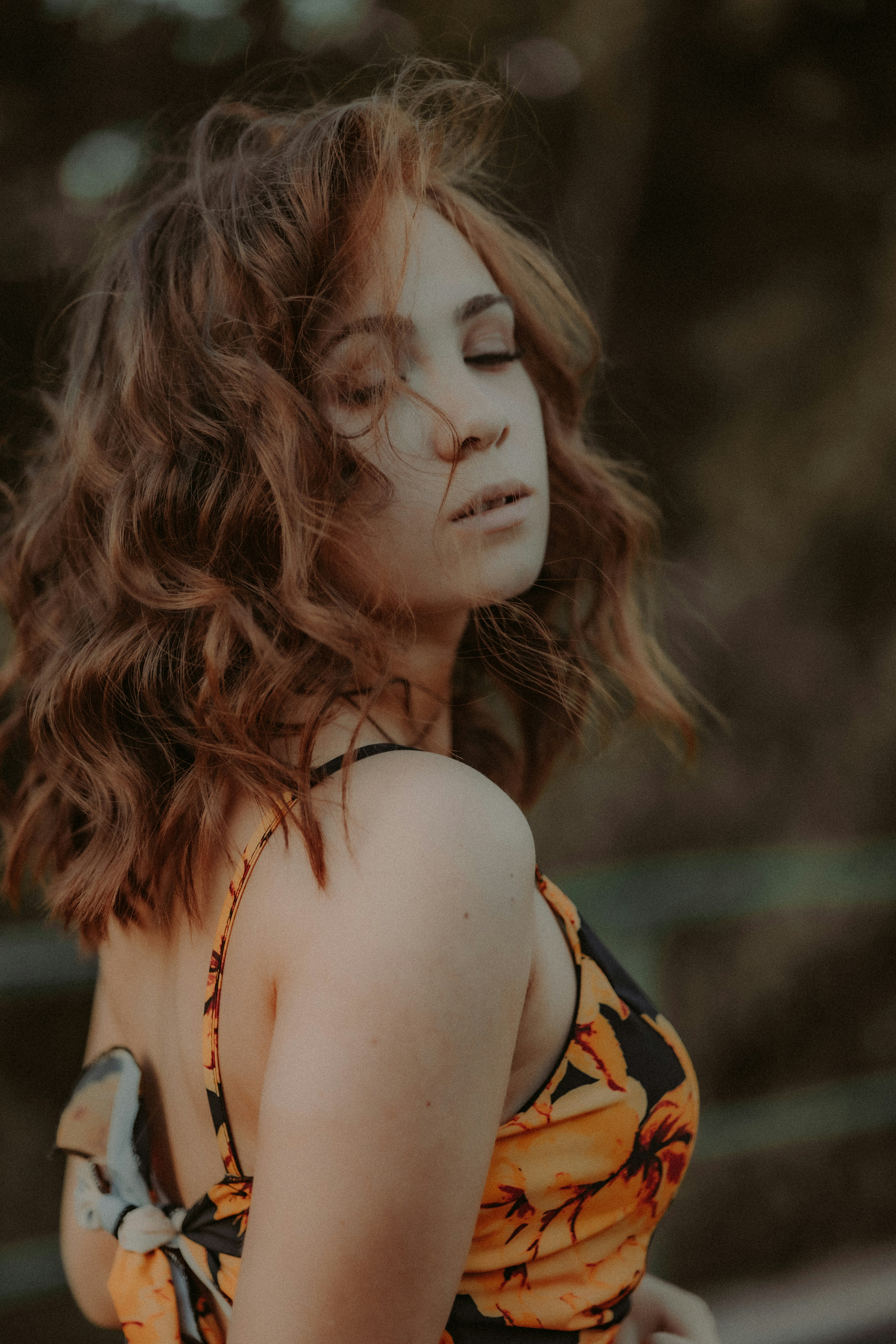 a woman with her eyes closed