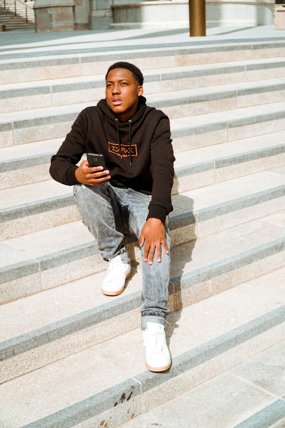 a man sitting on stairs