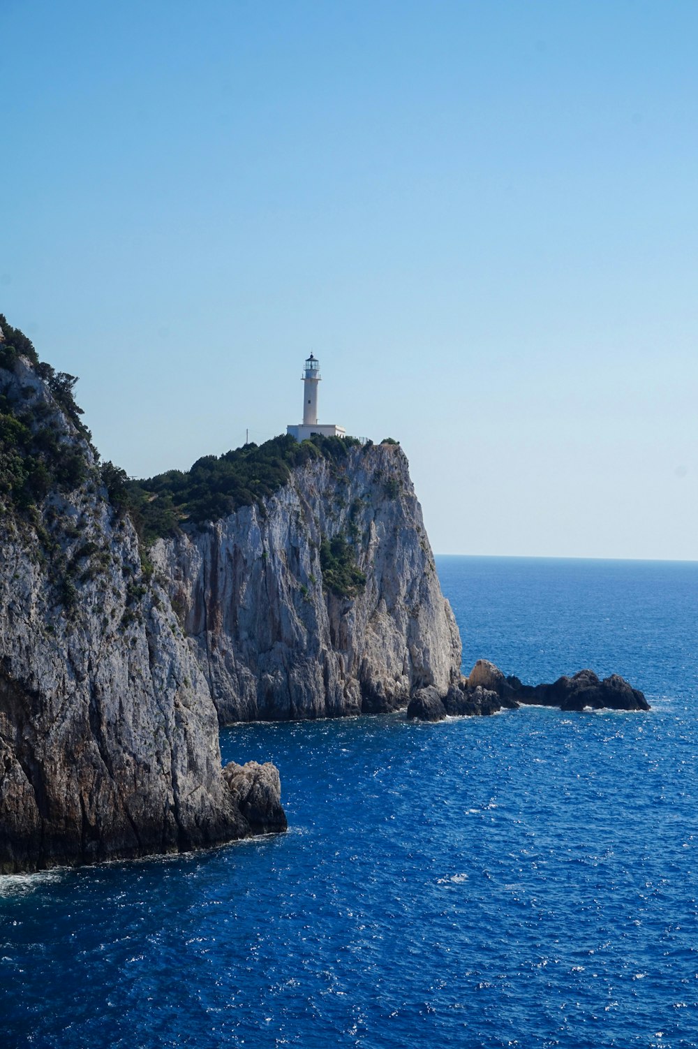 a lighthouse on a rocky cliff