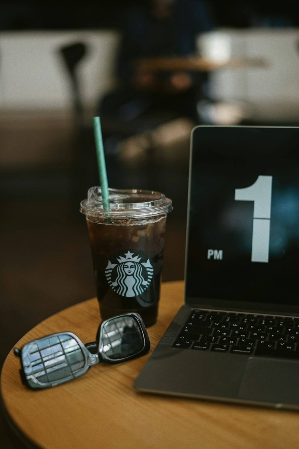 a cup of coffee and a laptop