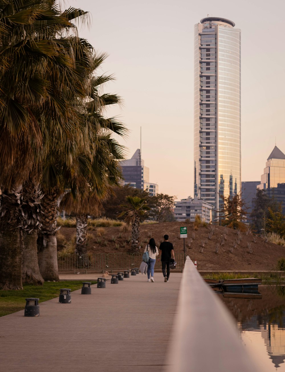 a couple walking on a sidewalk