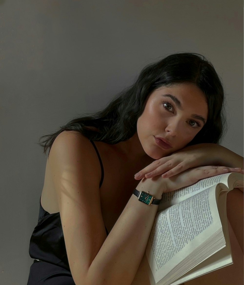 a woman holding a book