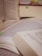 A diverse group of students studying together with books and notes spread out.