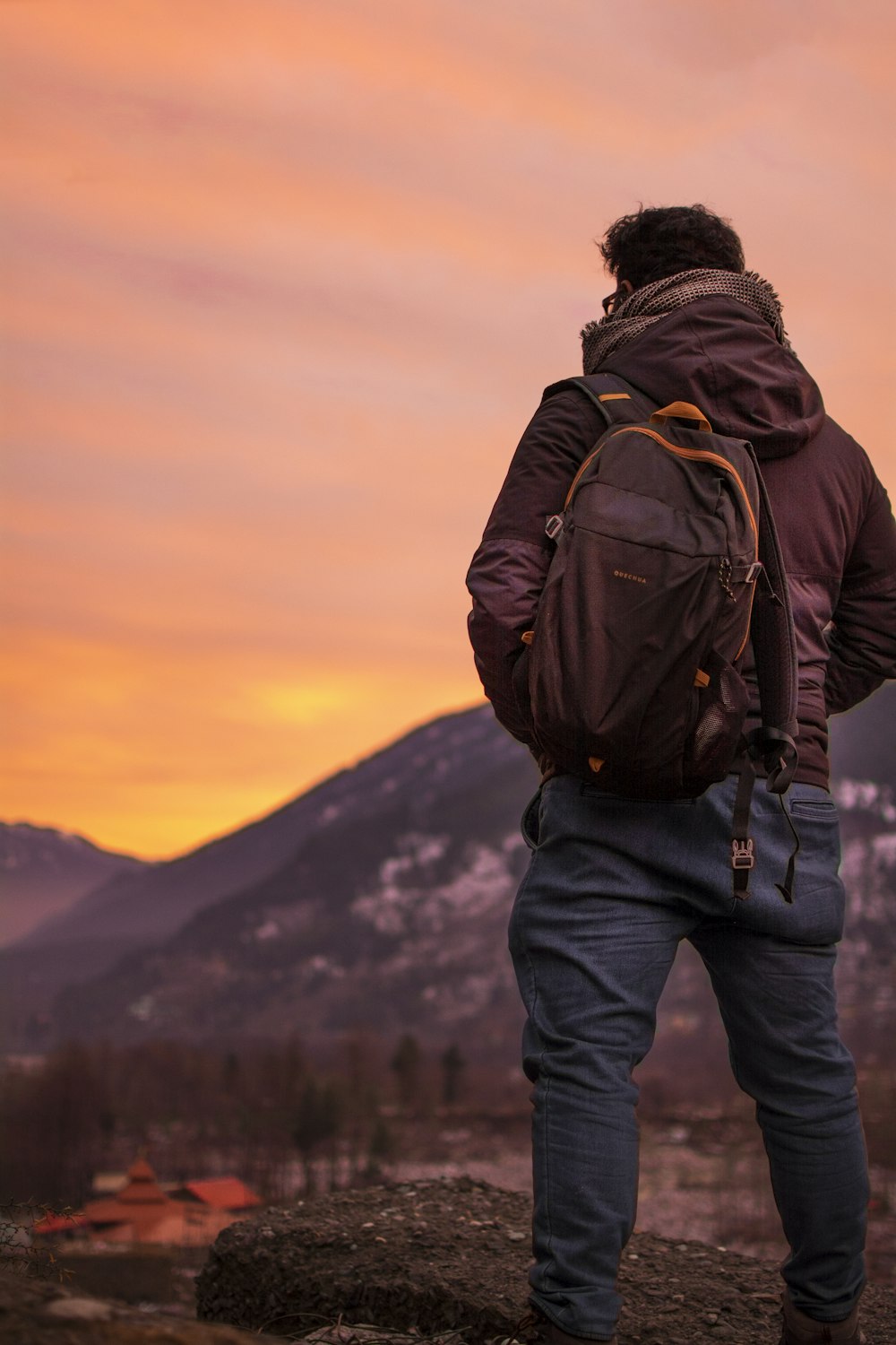 a person standing on a rock