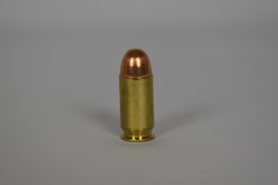 Diagram illustrating bullet trajectory with drag and wind effects.