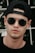 a person wearing sunglasses and a hat