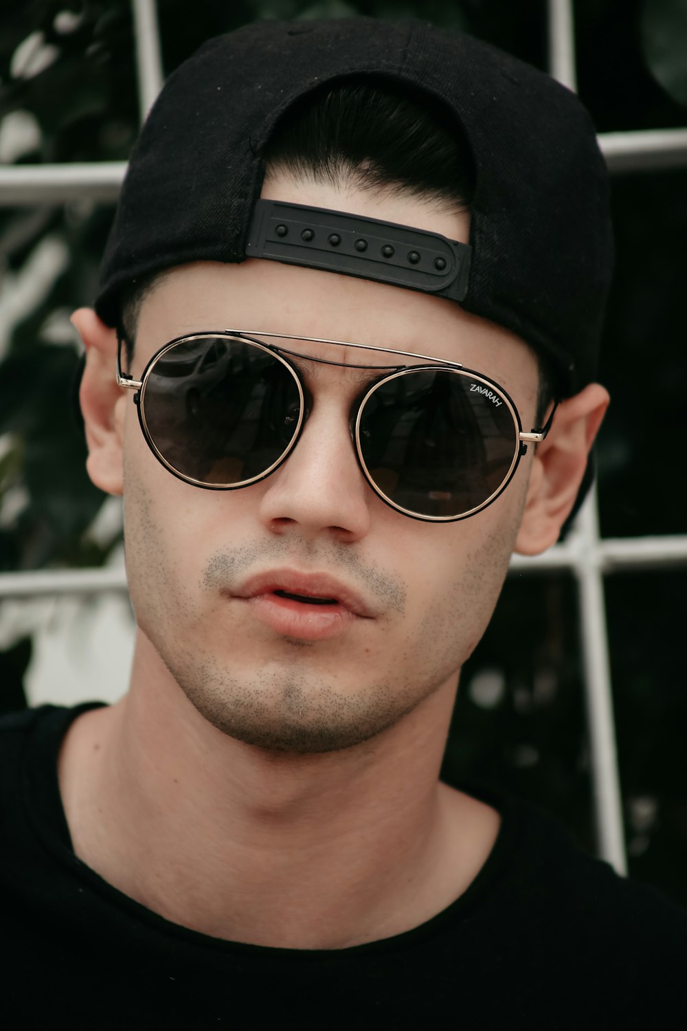 a person wearing sunglasses and a hat