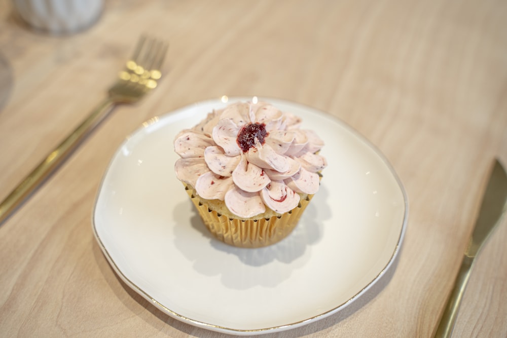 a cupcake with a flower design on it