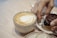 A happy customer enjoying a cup of coffee.