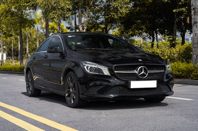 a black car parked in a parking lot