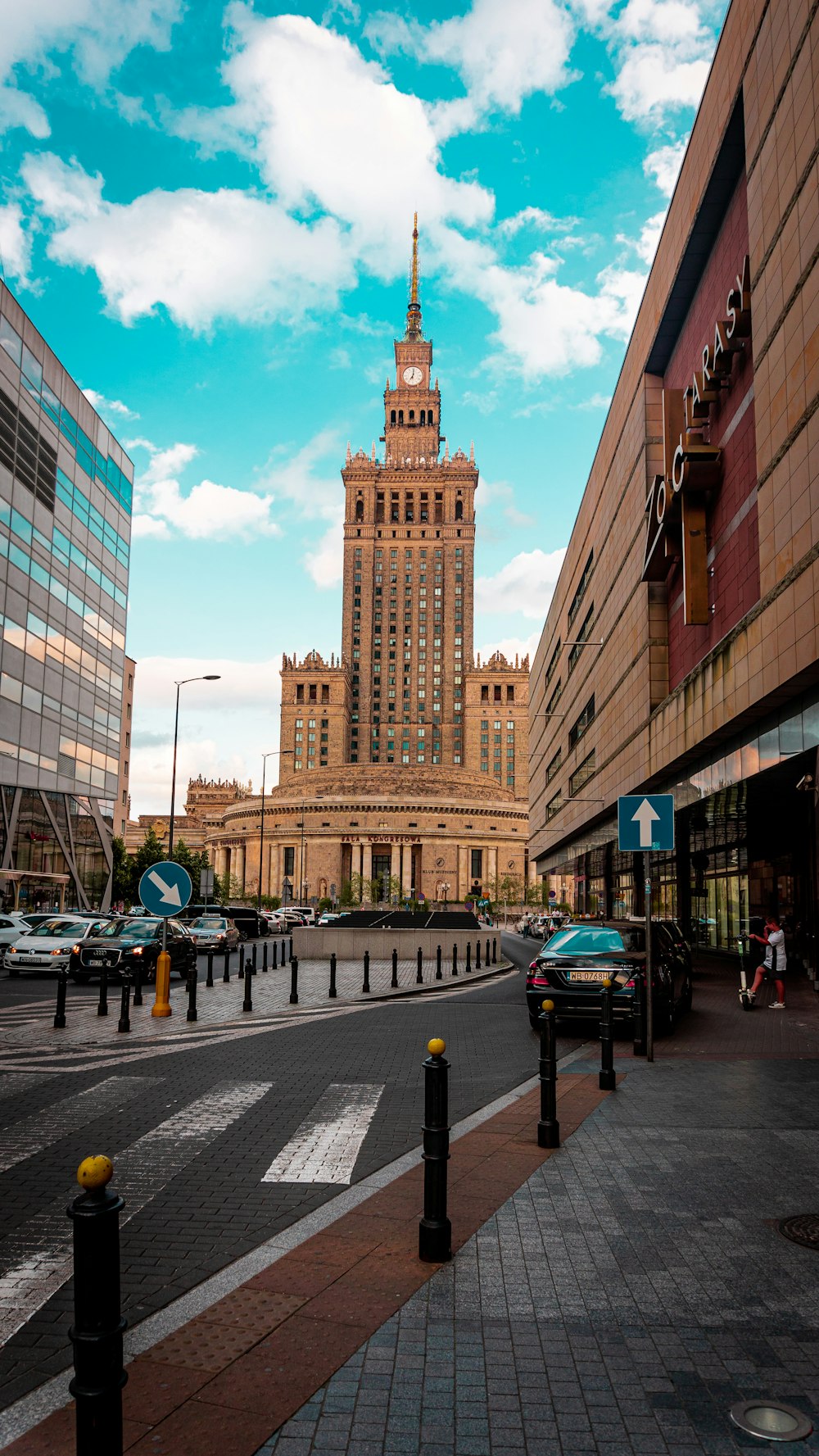 a large building towers over a city