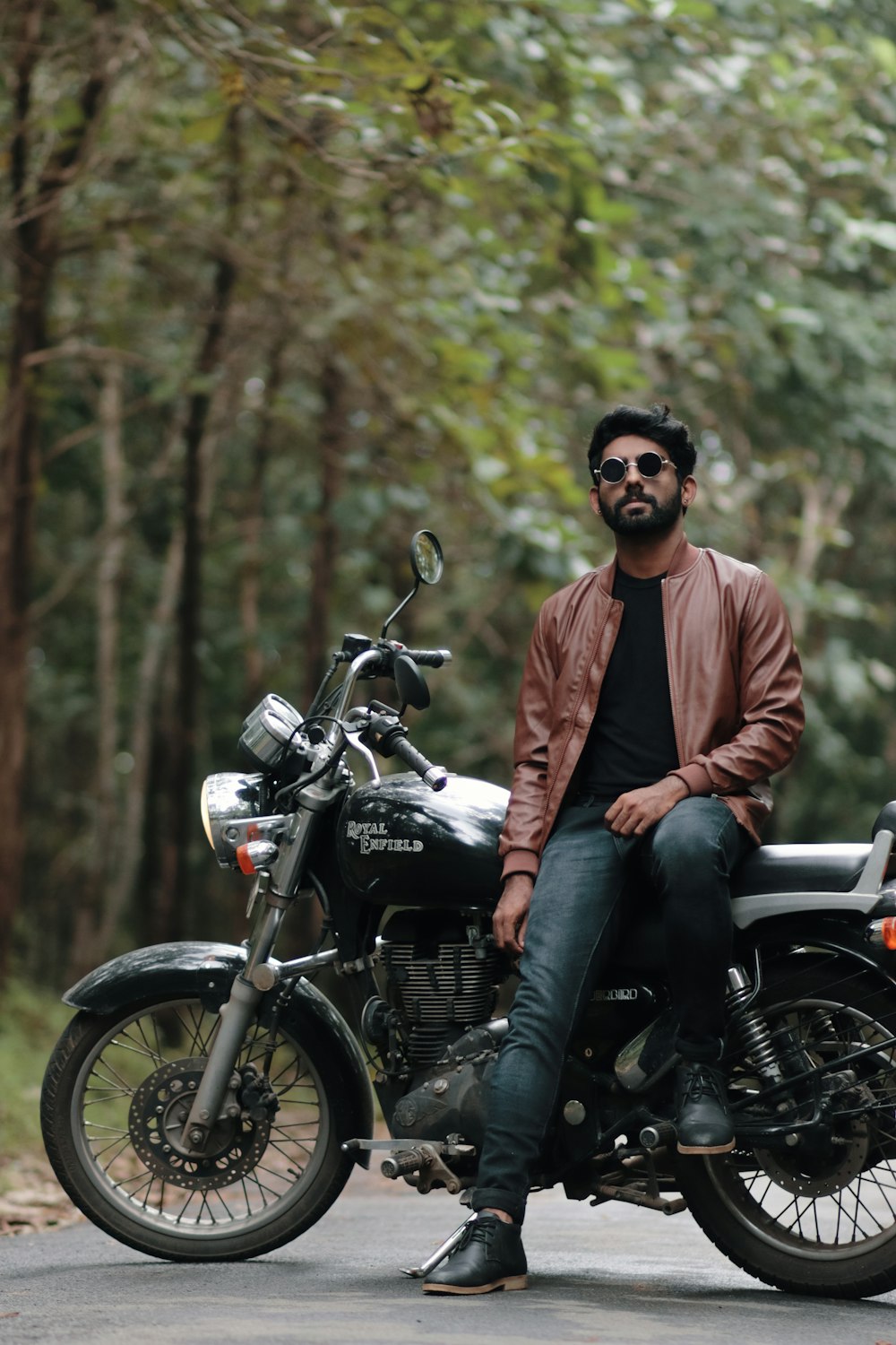 a man sitting on a motorcycle