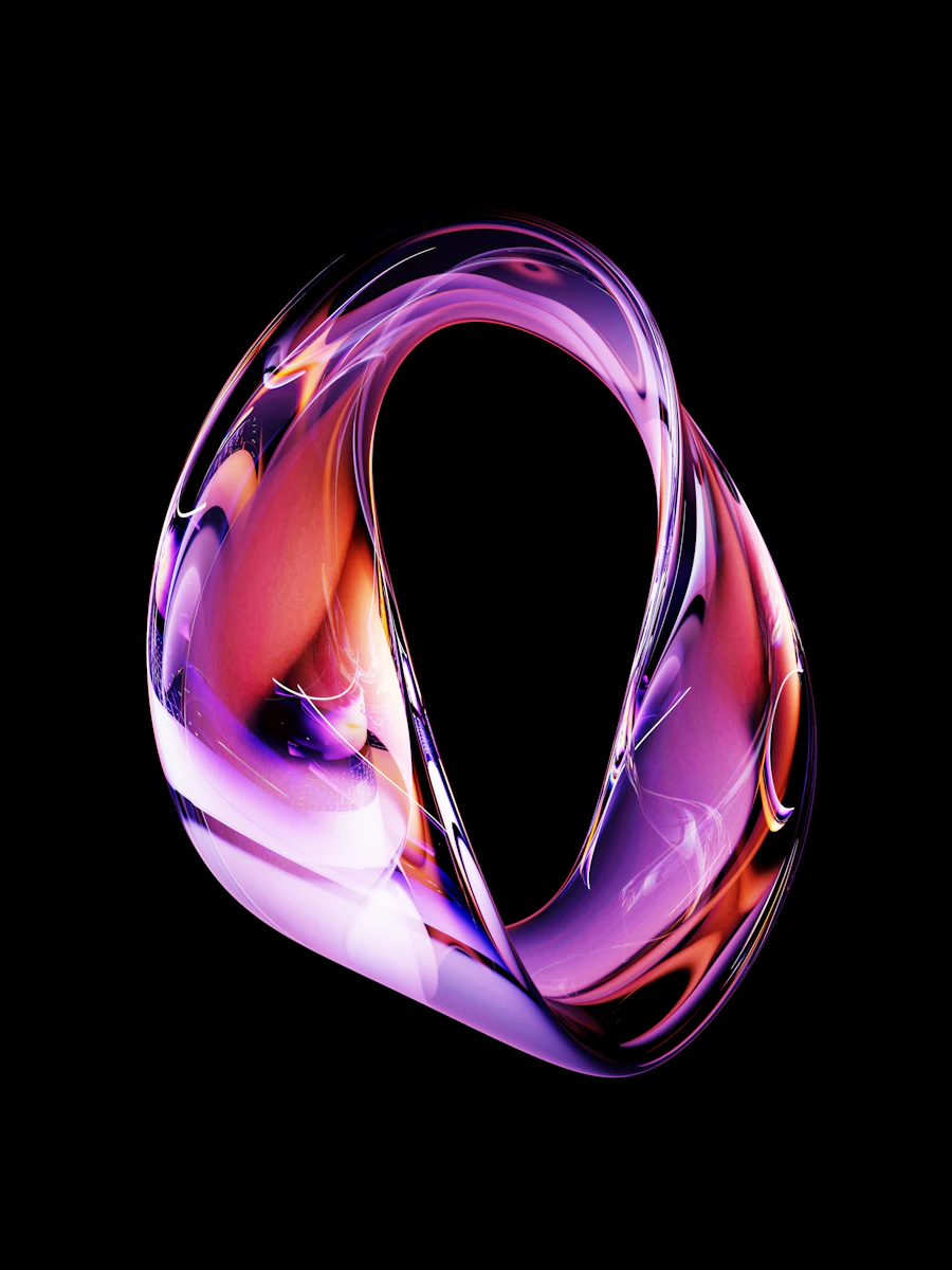 A glass ring lit magenta and amber